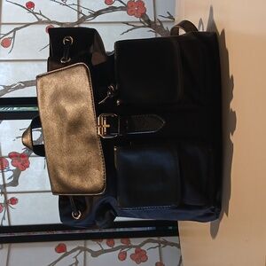 Nieman Marcus black backpack similar to Coach Crosby backpack